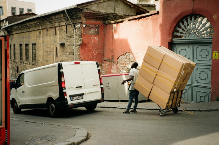 a man is loading boxes from a van - relocate your SSISDB